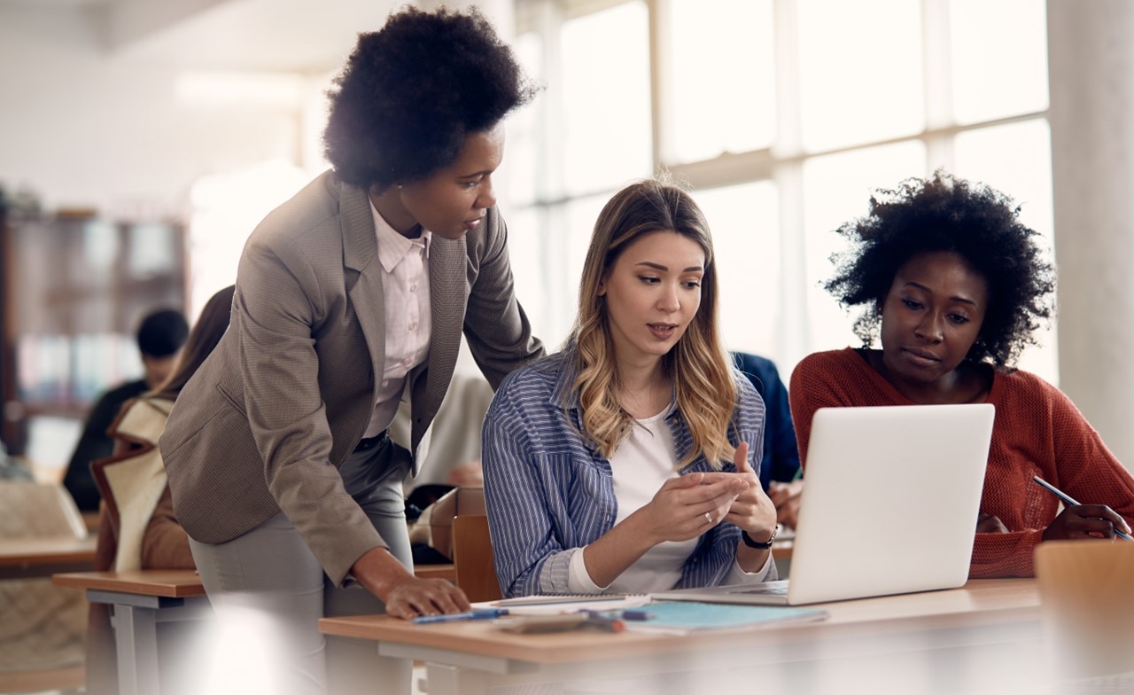 Group of women looking at a computer