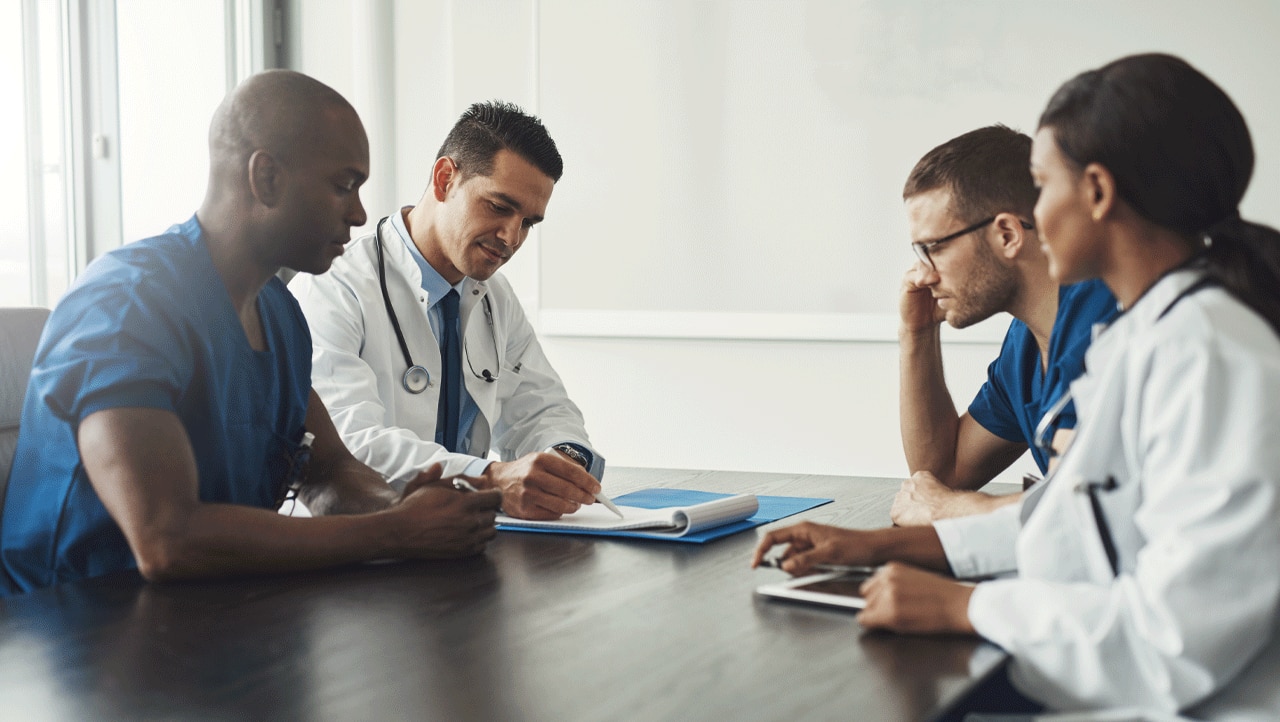 Healthcare professionals meet to discuss prescribing and patient needs