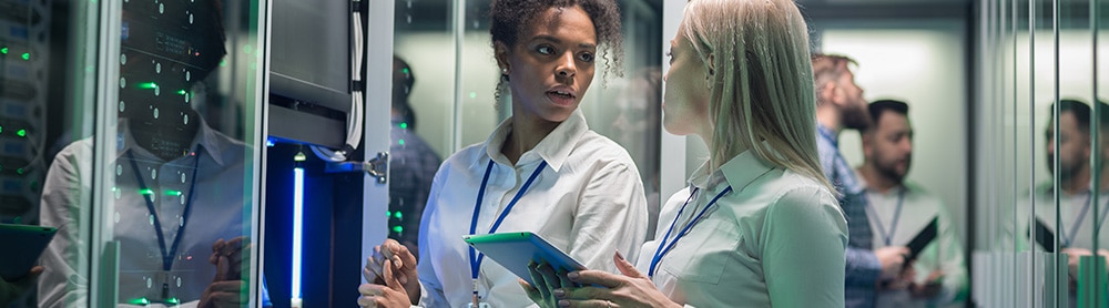Two consultants in a server room 