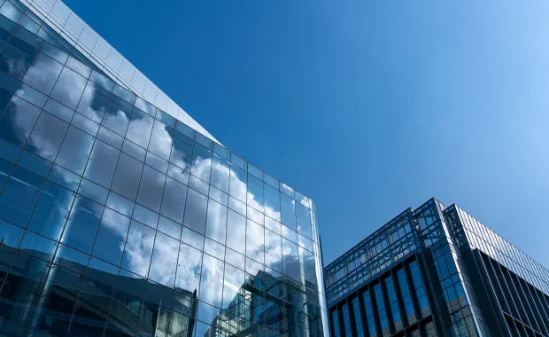 Clouds reflecting on glass building