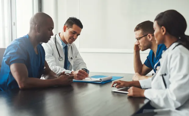 clinicians completing paperwork