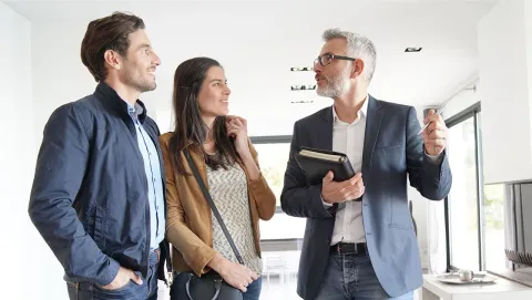 estate agent showing a couple a property